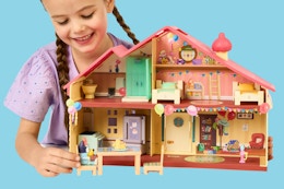 child playing with a Bluey Celebration Home
