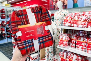 hand holding a wondershop matching family pajama set at target