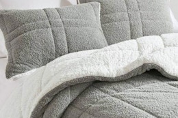 Lifestyle image of the Madison Park Comforter Set from Home Depot (in the color grey w/ reverse white Sherpa)