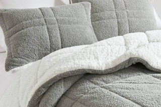 Lifestyle image of the Madison Park Comforter Set from Home Depot (in the color grey w/ reverse white Sherpa)