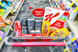colgate toothpaste, axe body wash, nivea body wash, maybelline makeup, garnier shampoo, and special k cereal in a cart