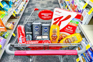 colgate toothpaste, axe body wash, nivea body wash, maybelline makeup, garnier shampoo, and special k cereal in a cart