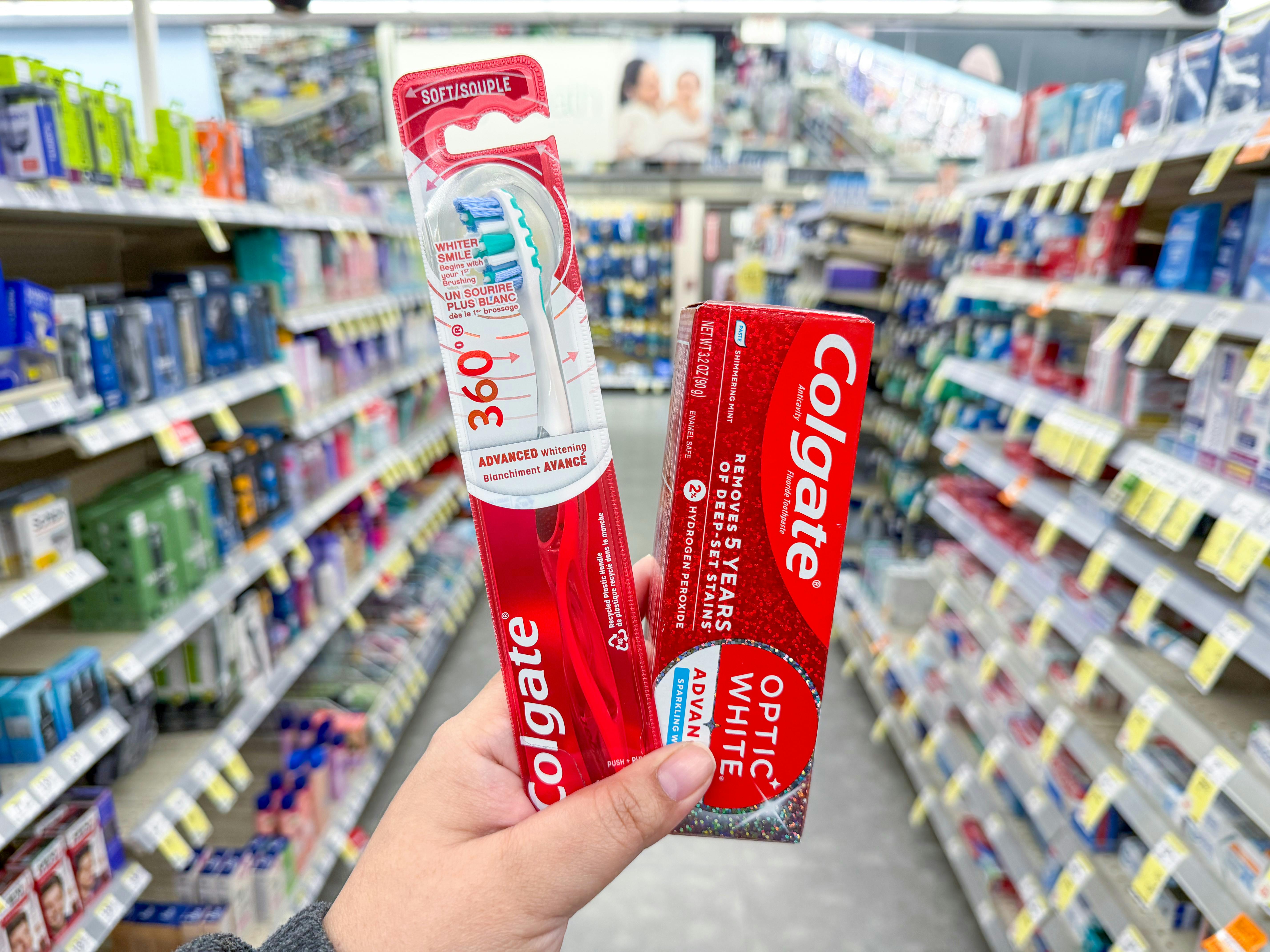 hand holding colgate oral care in walgreens