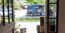an amazon delivery person delivering a package