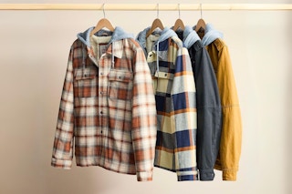 Levi's Men's Sherpa-Lined Hooded Shirt Jackets hanging on hangers