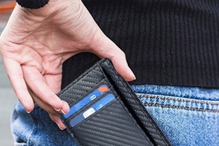 a rfid wallet being pulled out of a pocket