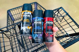hand holding axe body sprays over cart
