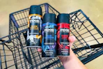 hand holding axe body sprays over cart