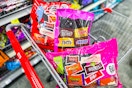 bags of halloween candy in a cart