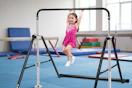 child using the black kids' gymnastic bar