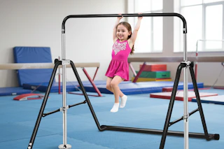 child using the black kids' gymnastic bar