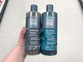 hand holding two bottles of dove men+care body wash at target
