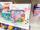 hand grabbing the Squishmallows slime kit
