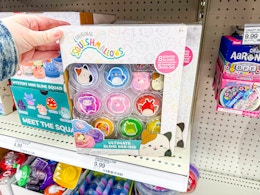 hand grabbing the Squishmallows slime kit