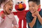 kids playing with elmo