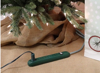 Phillips green power strip under a Christmas tree