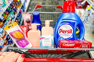 cart full of toothpaste, detergent, shampoo, lotion, monistat wipes, makeup brush, and makeup sponges