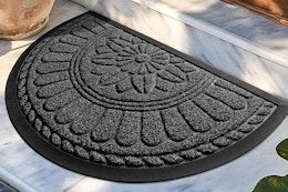 a rubber doormat in front of a home