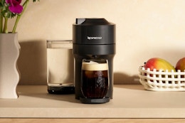 Nespresso Vertuo Pop+ Coffee and Espresso Machine by De'Longhi, Liquorice Black on a countertop.