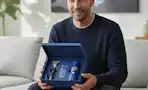 a man holding the harry's plus gift set