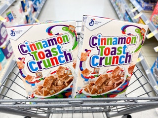 two boxes of cinnamon toast crunch in shopping cart