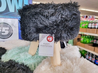 black fuzzy footstool