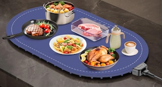 food in bowls and plates on a food warmer 