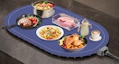 food in bowls and plates on a food warmer