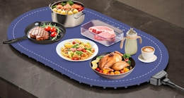 food in bowls and plates on a food warmer