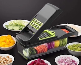 a vegetable chopper surrounded by cut vegetables in bowls