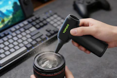 air duster being used at desk