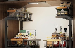 two organizers in a cabinet with a light