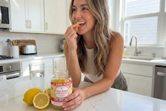 a woman eating lunakai collagen gummies