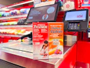 children's motrin and children's tylenol sitting in front a check out