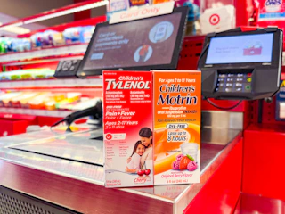 children's motrin and children's tylenol sitting in front a check out