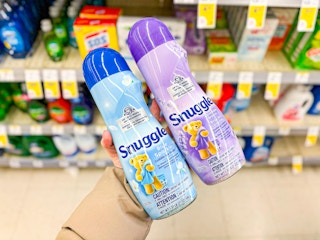 hand holding snuggle scent boosters in walgreens