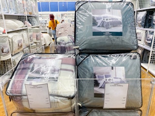 UGG comforter sets in a bin