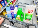 paper towels, toilet bowl cleaner, and more cleaning supplies in a cart