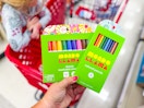 hand holding mondo llama crayons in front of a target shelf