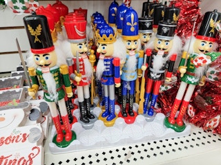 a variety of nutcrackers on a shelf