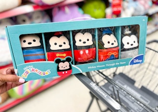 box of Disney Mickey Mouse: Through the Years Squishmallows sitting on top of shopping cart