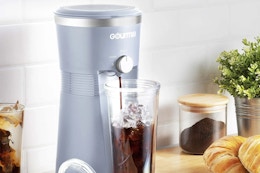 light blue iced coffee machine with tumbler