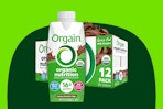A 12-pack of Orgain Organic Protein Shakes with 16g protein in creamy chocolate fudge flavor with one large carton in front of the case.