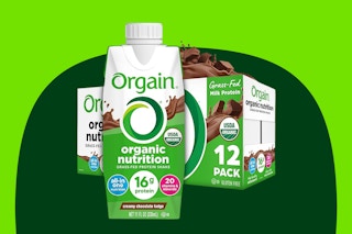 A 12-pack of Orgain Organic Protein Shakes with 16g protein in creamy chocolate fudge flavor with one large carton in front of the case.