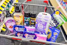softsoap hand soap, crest toothpaste, axe body spray, gillette and venus razors, and coppertone lip balm in a cart
