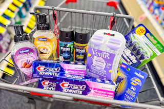 softsoap hand soap, crest toothpaste, axe body spray, gillette and venus razors, and coppertone lip balm in a cart