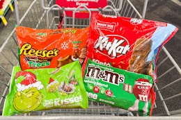 reese's, kit kat, hershey's, and M&Ms Christmas candy in a cart