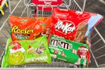 reese's, kit kat, hershey's, and M&Ms Christmas candy in a cart