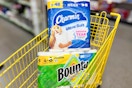 charmin and bounty stacked in yellow shopping cart