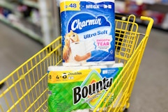 charmin and bounty stacked in yellow shopping cart
